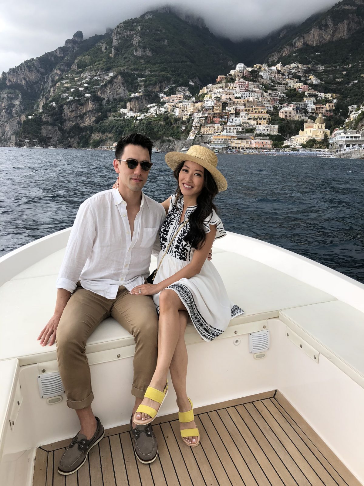 boat ride on positano amalfi coast italy couple trip