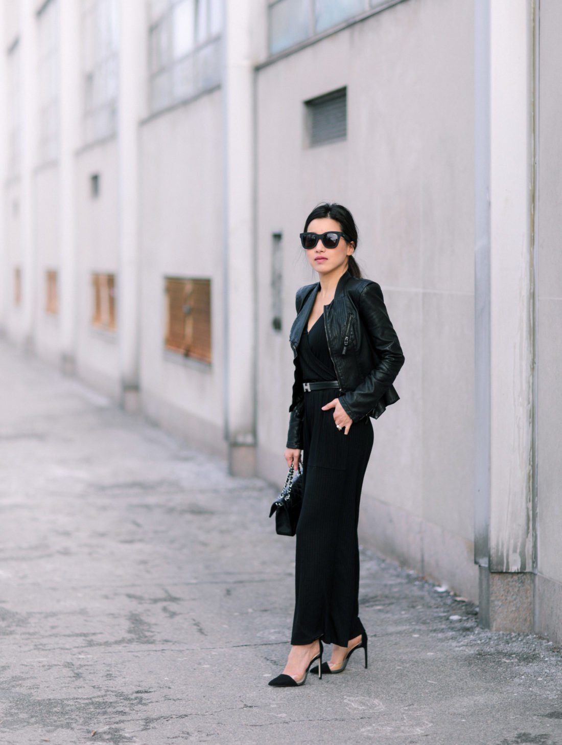 how to style a black jumpsuit with leather jacket