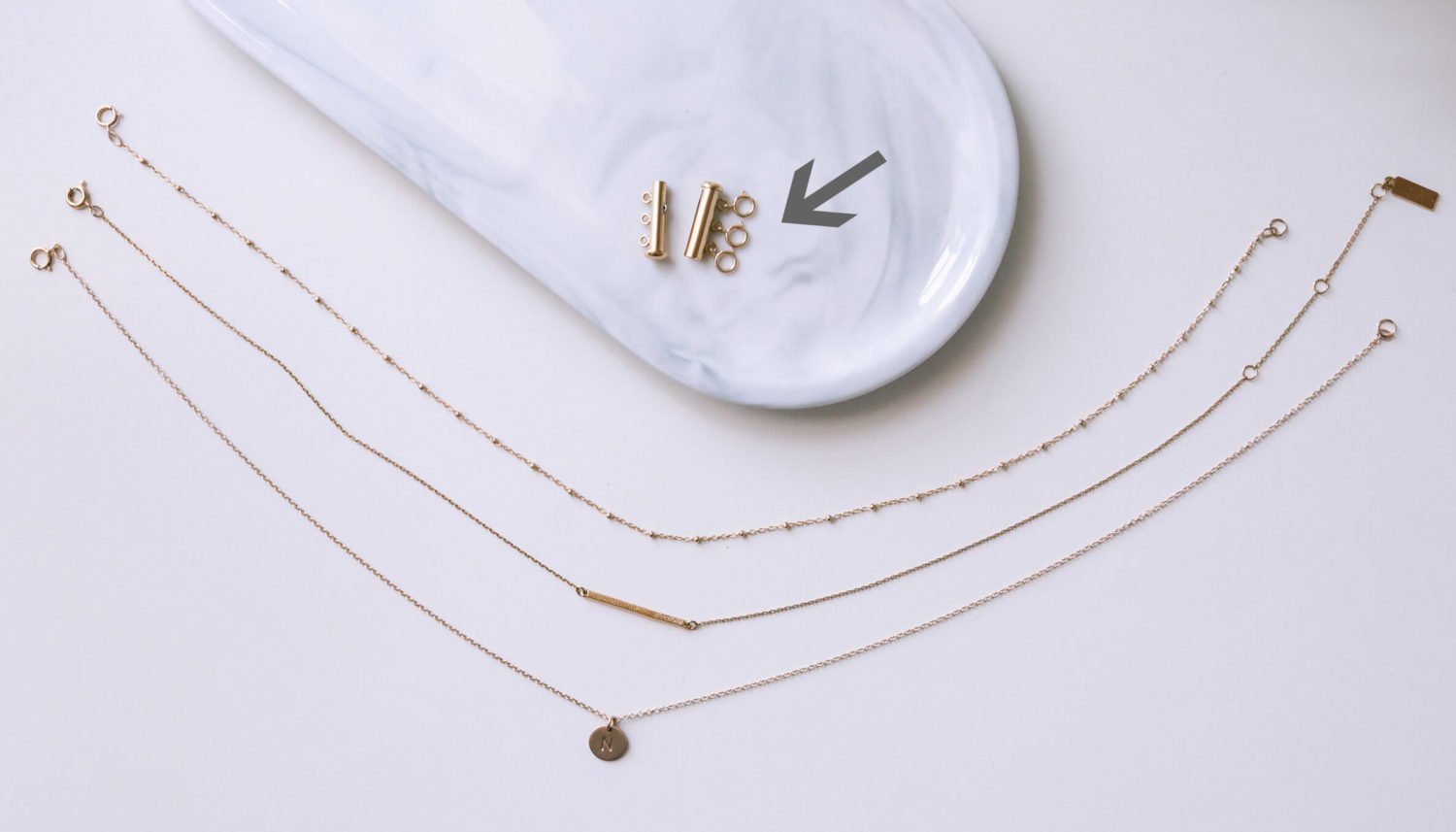 how to layer necklaces without tangling