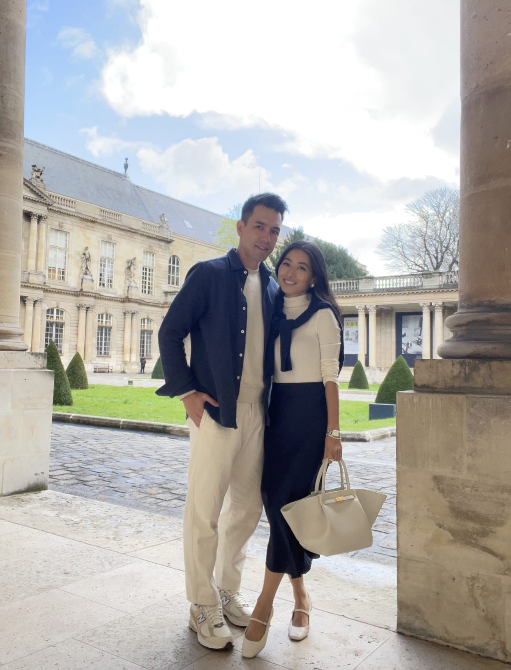 his hers couples outfit sezane navy blue slip skirt demellier bag